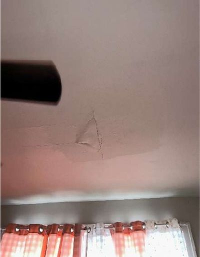 Water infiltration staining and cracking on a bedroom ceiling in a Fern Rock Philadelphia rowhome, found during a home inspection