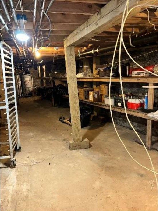 Leaning basement support post in a Fishtown, PA row home, documented during a home inspection