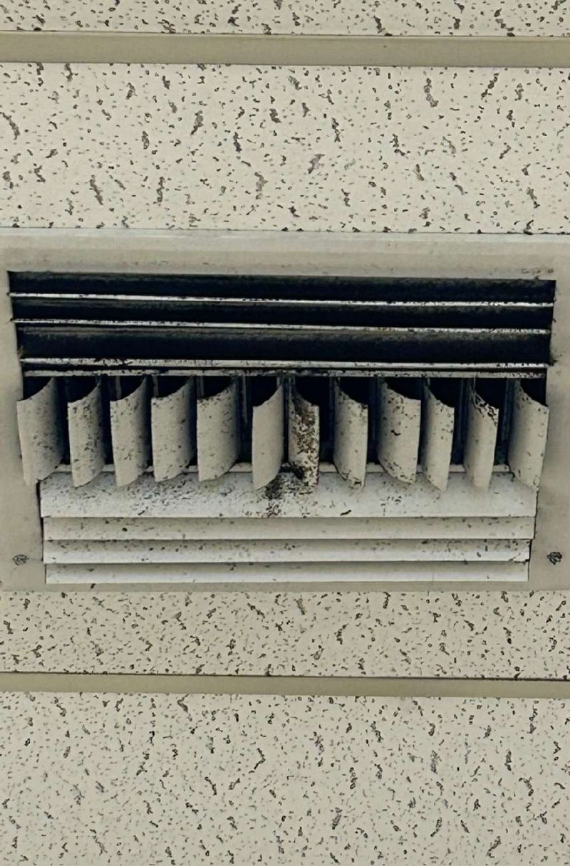 Close view of mold on an HVAC supply register in an Aston, PA office suite where air testing came back elevated