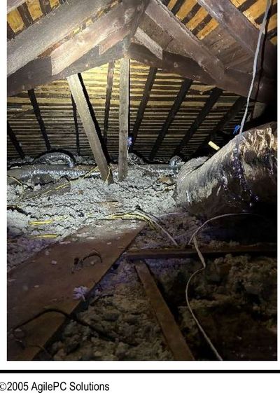 Open electrical splice with exposed wiring in the attic of a Roxborough Philadelphia home, found during a June 2026 home inspection