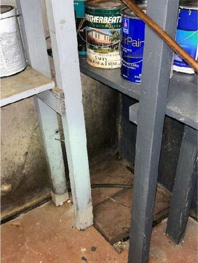 Basement wall rebuilt with patched masonry around the plumbing waste drain in a 1946 Yardley PA home, found during a June 2026 home inspection