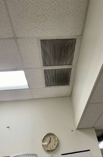 Dark soiling on an HVAC return grille in the ceiling of a Pottstown PA commercial building, September 2026 mold testing