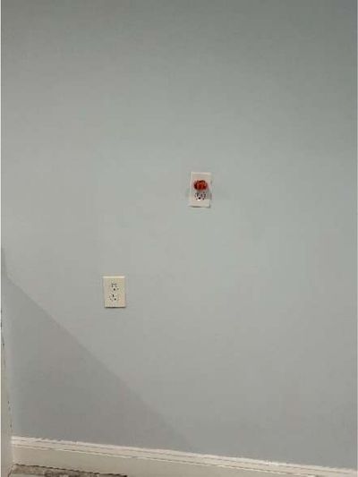 Ungrounded and dead three-prong receptacles on a wall in a Lawncrest Philadelphia row home, documented during a home inspection