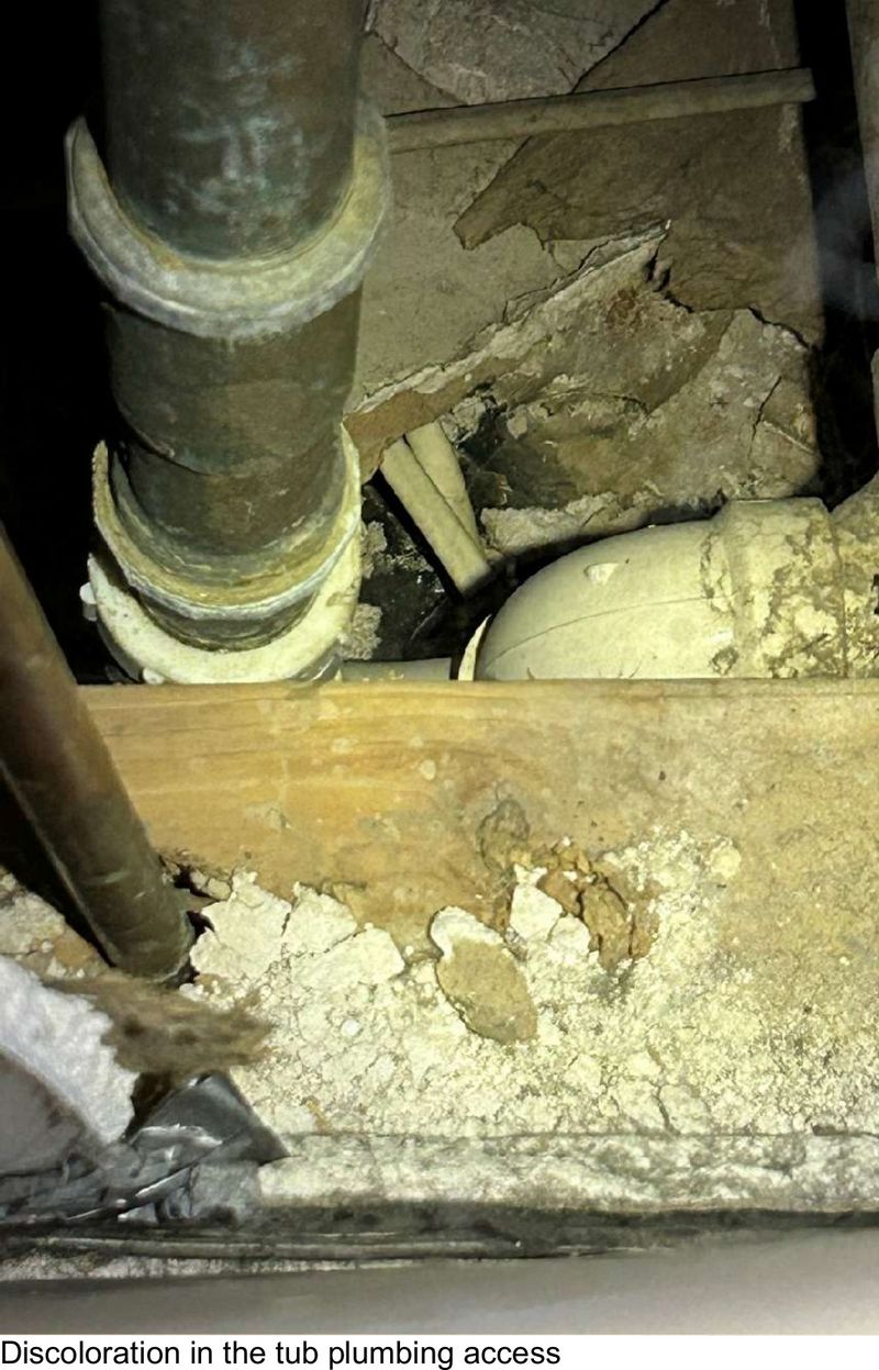 Discoloration around tub plumbing in a West Chester, PA bathroom, documented during a home inspection