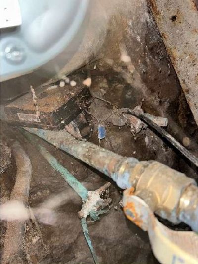 Corroded water supply piping with green corrosion at the fittings in a Fishtown Philadelphia rowhome basement, found during a May 2026 home inspection