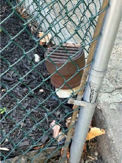 Corroded metal water heater chimney with a hole rusted through it, a venting hazard, in a Logan / Fern Rock North Philadelphia home, found during a June 2026 home inspection