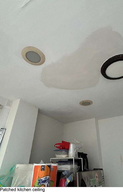 Blistered and patched section of a kitchen ceiling around a recessed light fixture in a Manayunk Philadelphia rental, from an August 2026 mold test