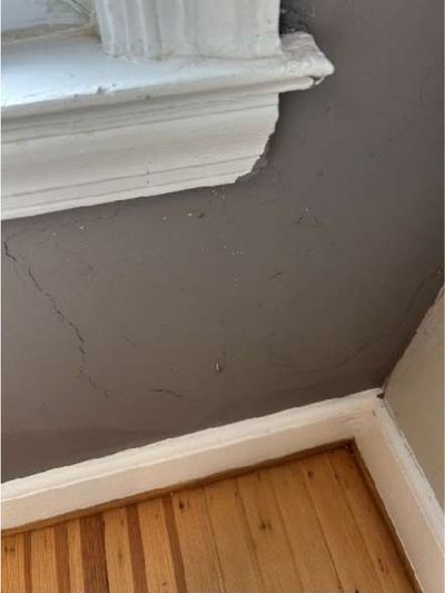 Cracked nine-inch basement floor tile flagged as possible asbestos in a 1946 Yardley PA home, during a June 2026 home inspection