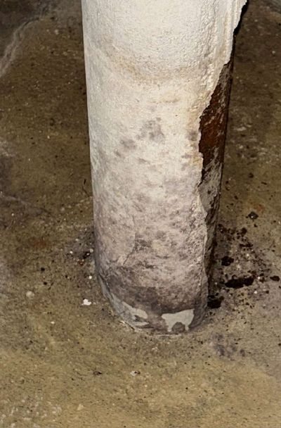 Water staining running down a basement support column in a Haddon Township NJ home, documented during an August 2026 mold test