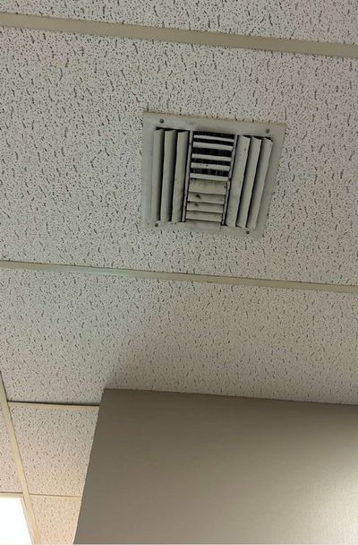 A ceiling-mounted HVAC supply register in an occupied office in a commercial suite in Aston, PA, one of the sampling locations during September 2026 mold testing