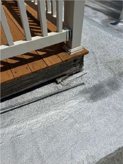 Deteriorated and unsecured rooftop pilot-house deck planks and fascia on a Port Richmond Philadelphia brick rowhome, documented during a June 2026 home inspection