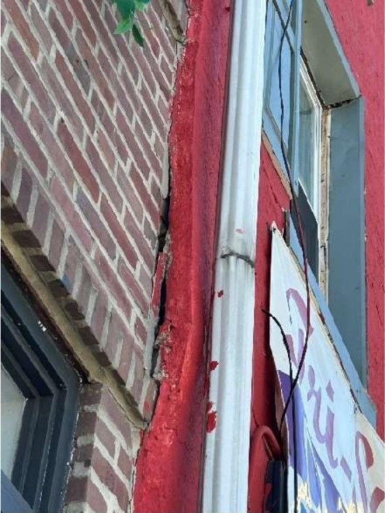 Cracked and shifting stucco facade on a Northern Liberties, PA home exterior, recorded during a home inspection