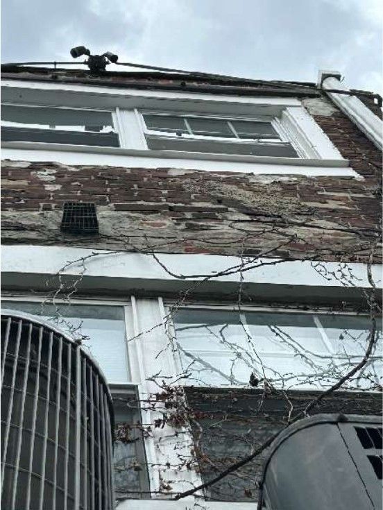 Deteriorated and shifted exterior brick wall on a Fishtown, PA home, documented during a home inspection