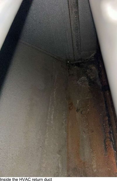 Interior of an HVAC central return duct with dark staining, sampled during an August 2026 mold test in a Haddon Township NJ basement