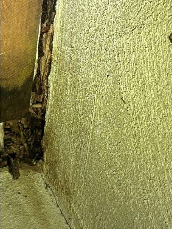 Rotted wood deck header showing structural decay at a Schwenksville, PA home, found during a home inspection