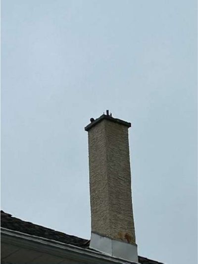 Stucco chimney with a missing weather cap on the flue liner on a pre-war Willow Grove PA home, found during a July 2026 home inspection